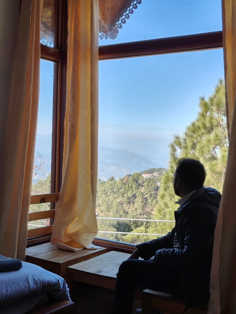 bay window hotel room with mountain view near ranikhet